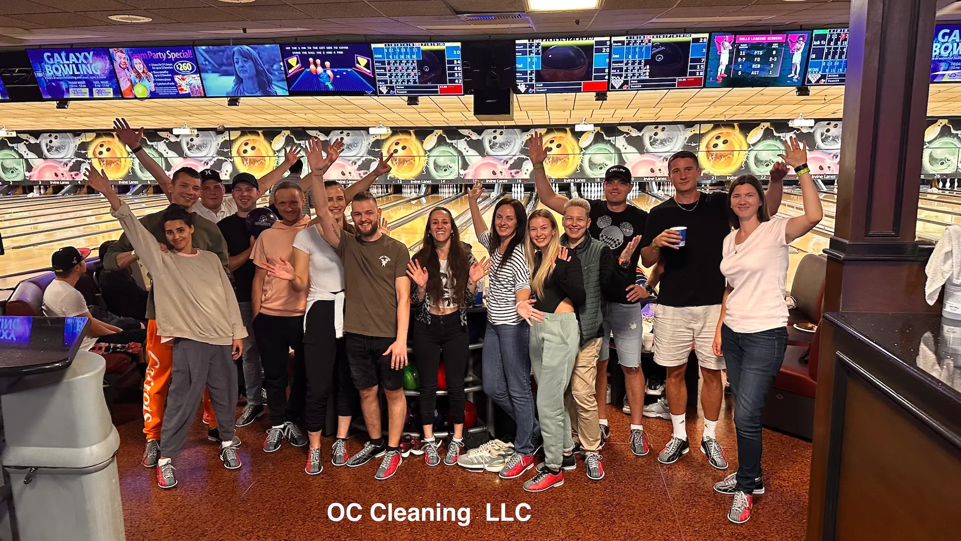 OC Cleaning Team Bowling Night Our cleaning company team waving at the bowling alley